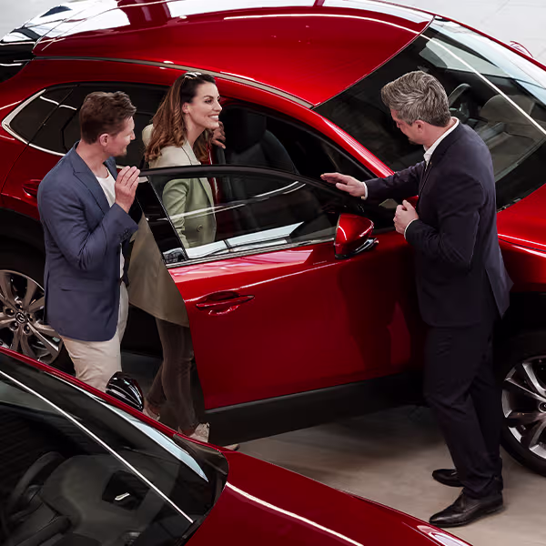 mazda salesman showing interieur 1